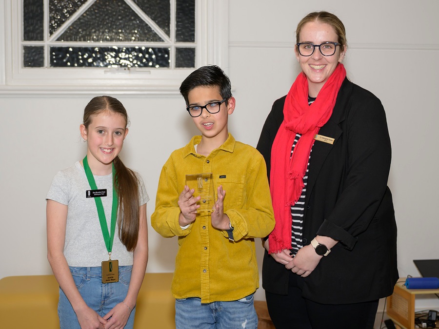 Mikail Liakos standing with Junior Mayor and Mayor