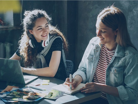 two young people studying together